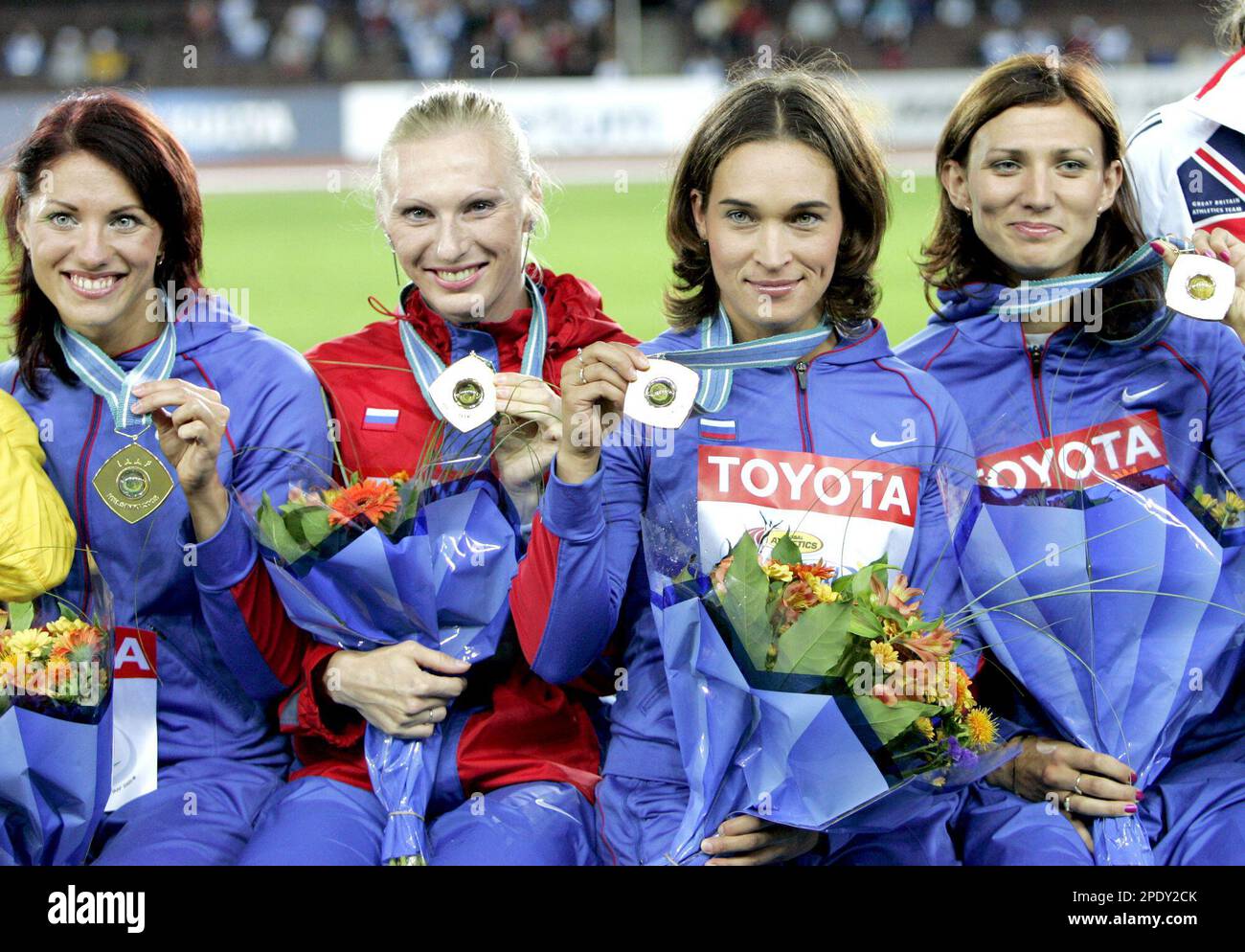 Members of the Russian team pose with the gold medal they won in the