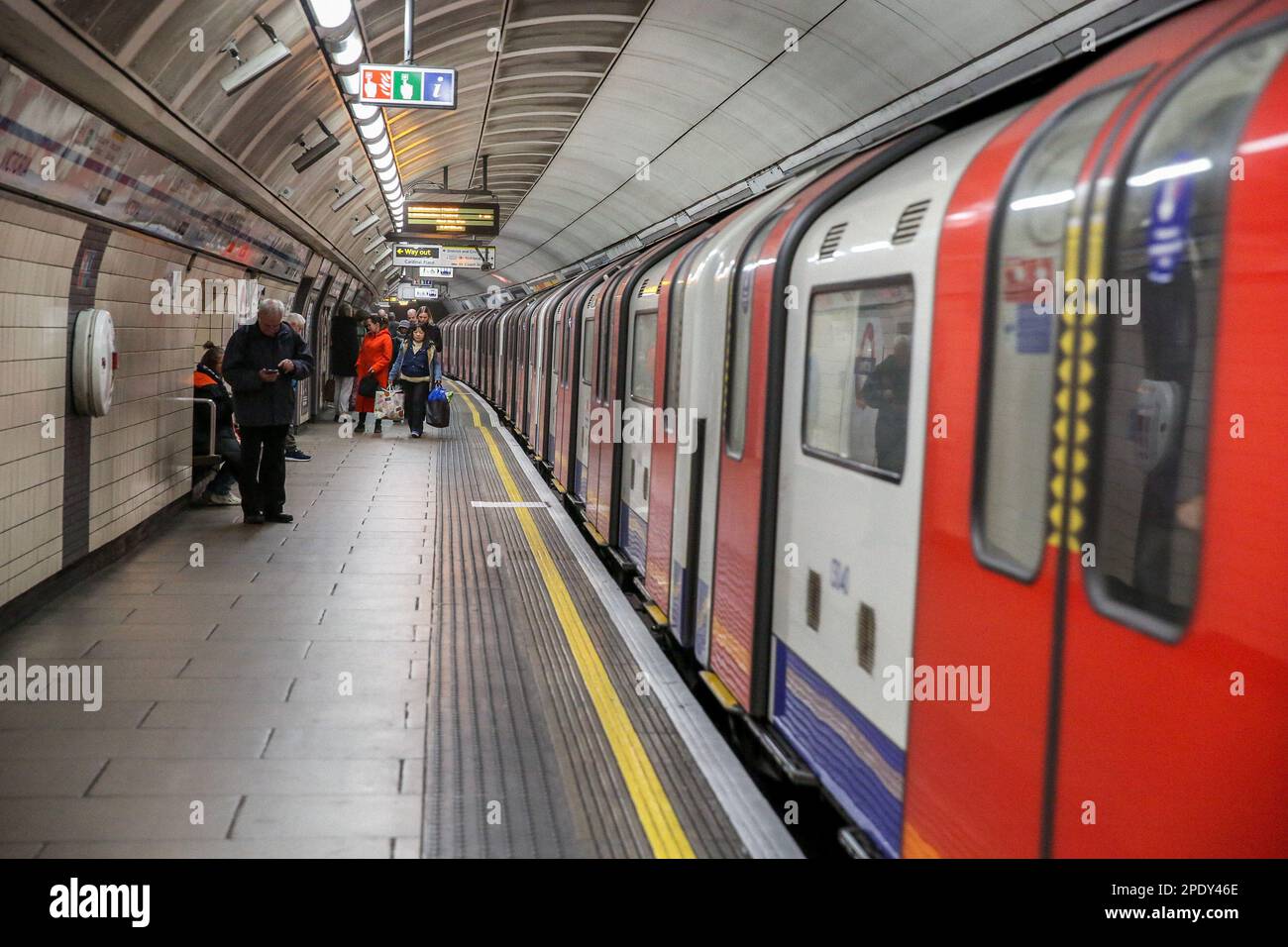 London, UK. 14th Mar, 2023. Commuters use the London Underground tube