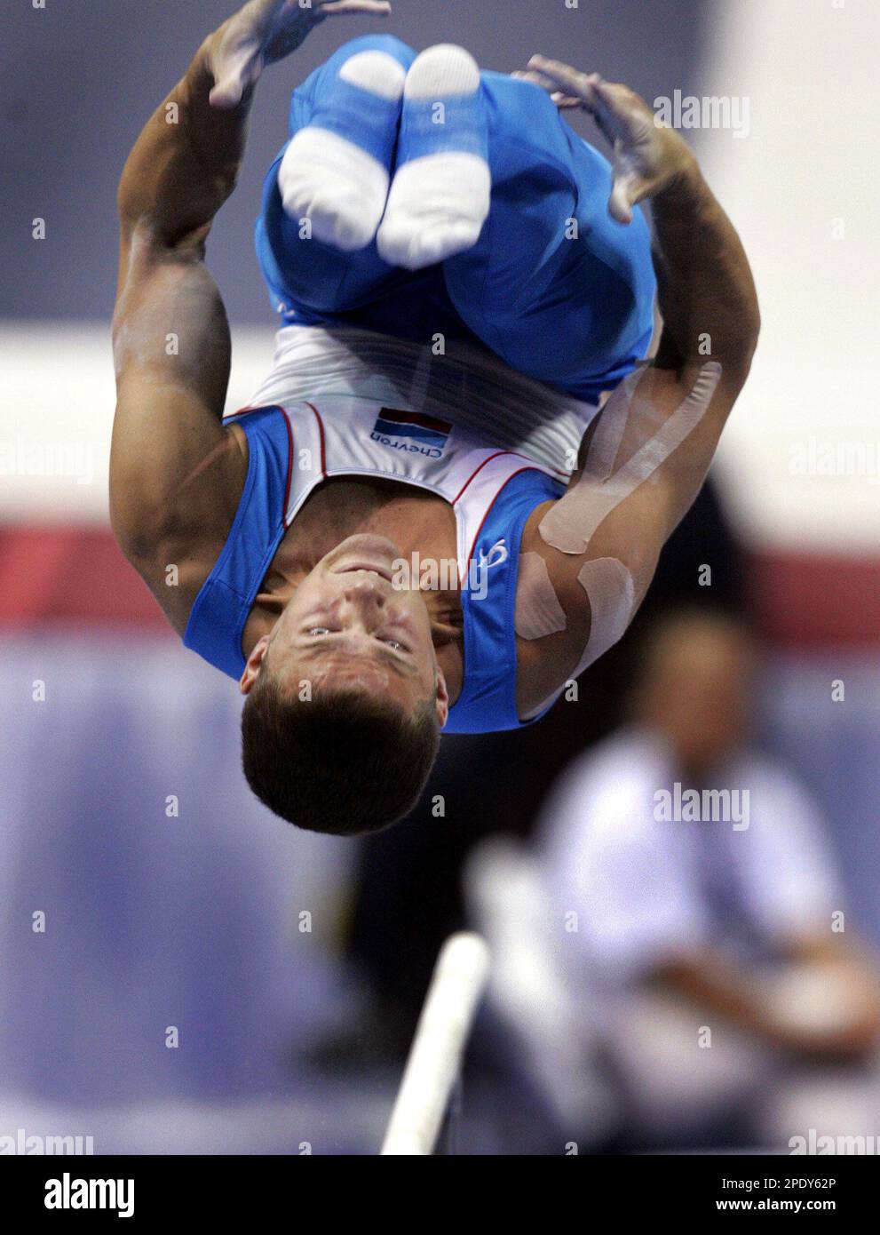 Todd Thornton dismounts from the parallel bars in the finals of the men