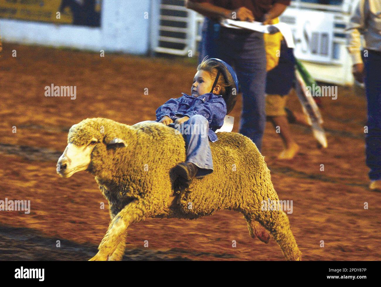 Alexys Skinner, 4, tries her hardest to keep a hold of her ride during