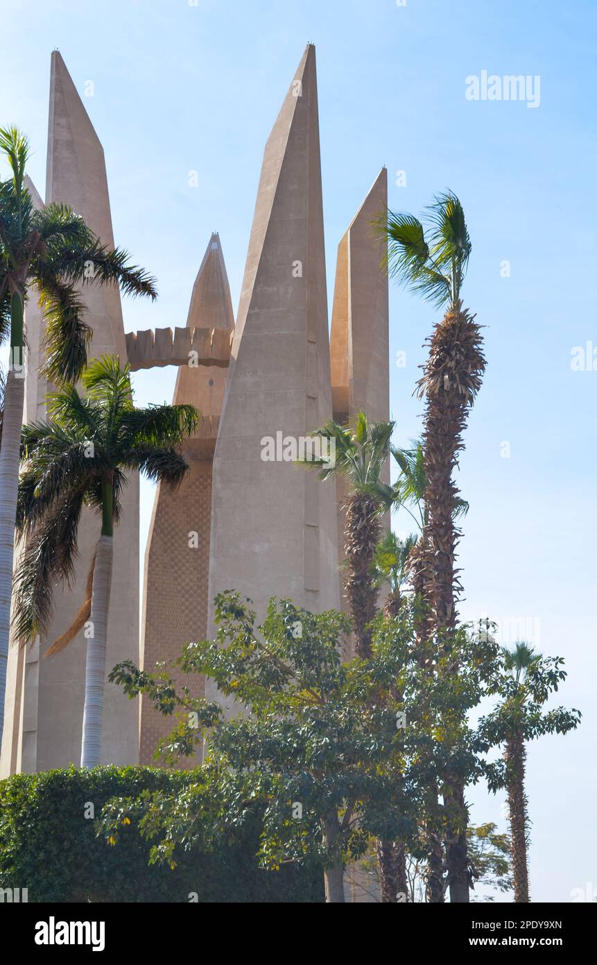 View of palm trees and Russian Egyptian friendship monument at High Dam ...