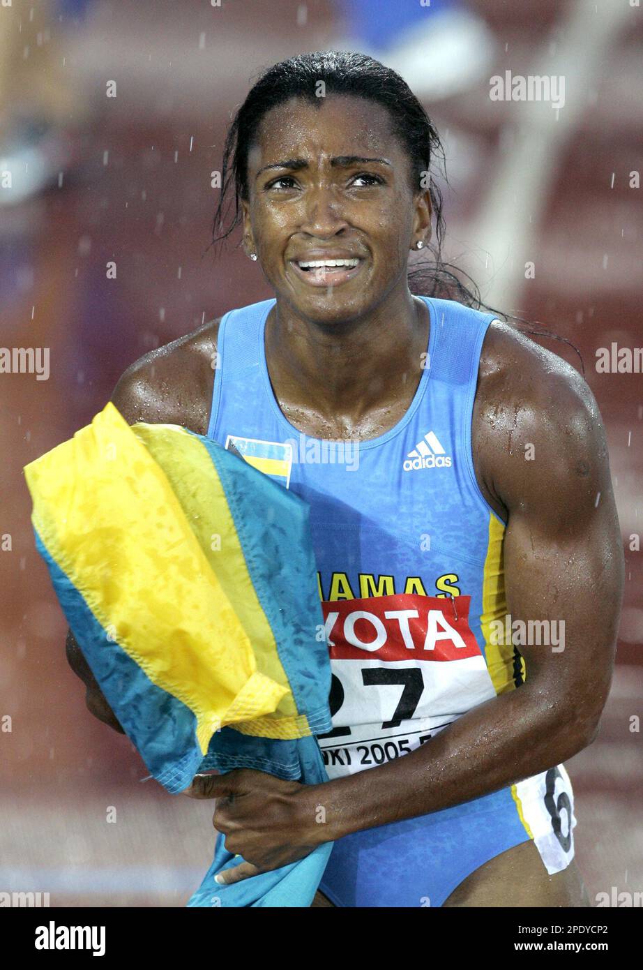Tonique Williams-Darling of the Bahamas reacts after she won