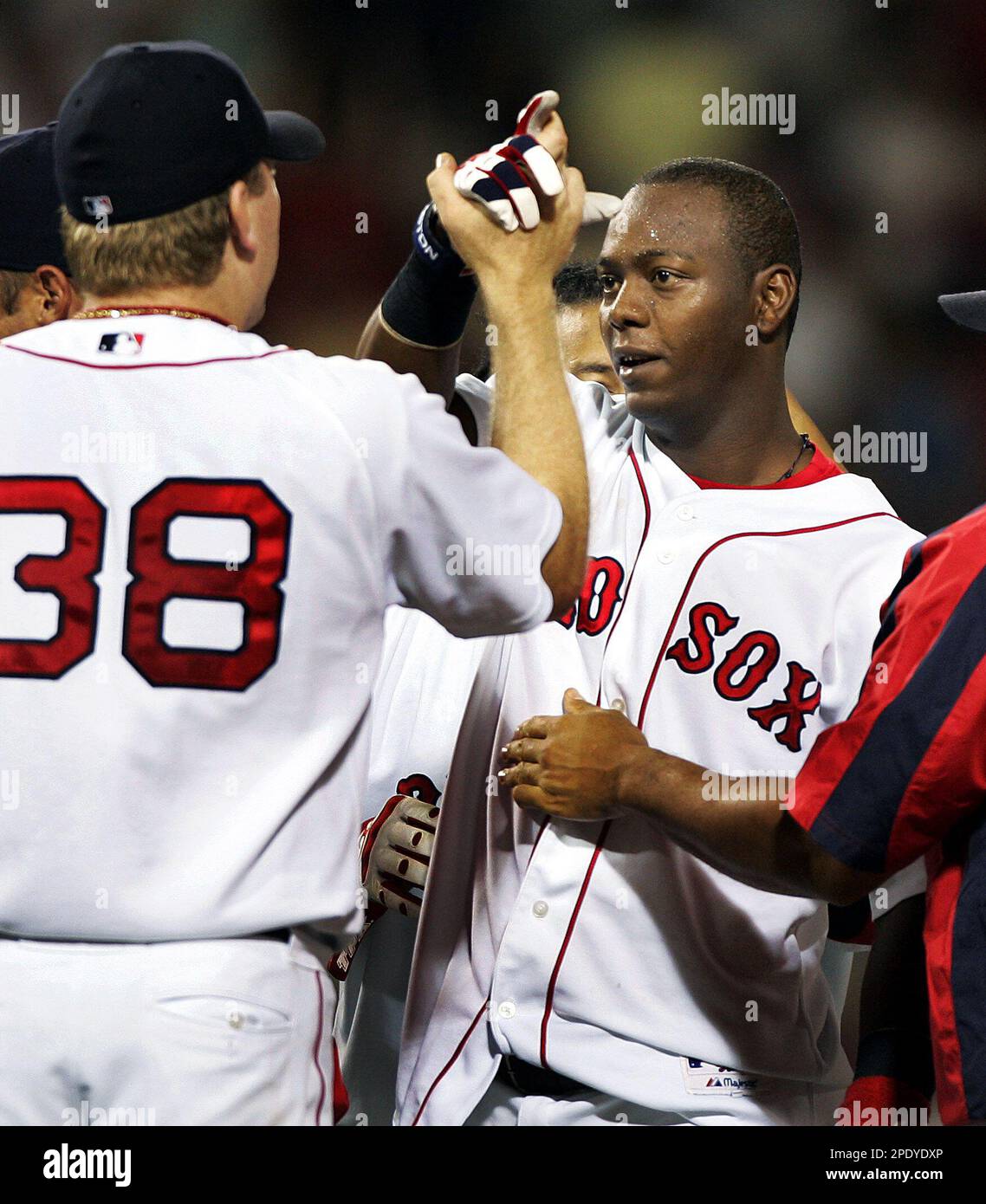 Boston Red Sox' Manny Ramirez, right, and Edgar Renteria hug back at the  dugout after Renteria hit a grand slam in the fifth inning against the New  York Yankees, Saturday, May 28