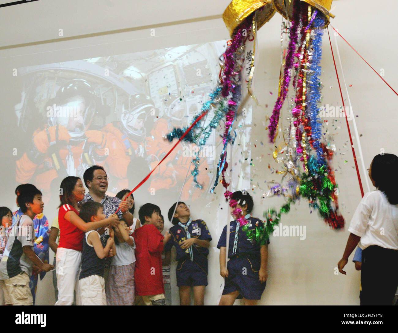 Chigasaki residents break a "Kusudama" paper ball containing colorful