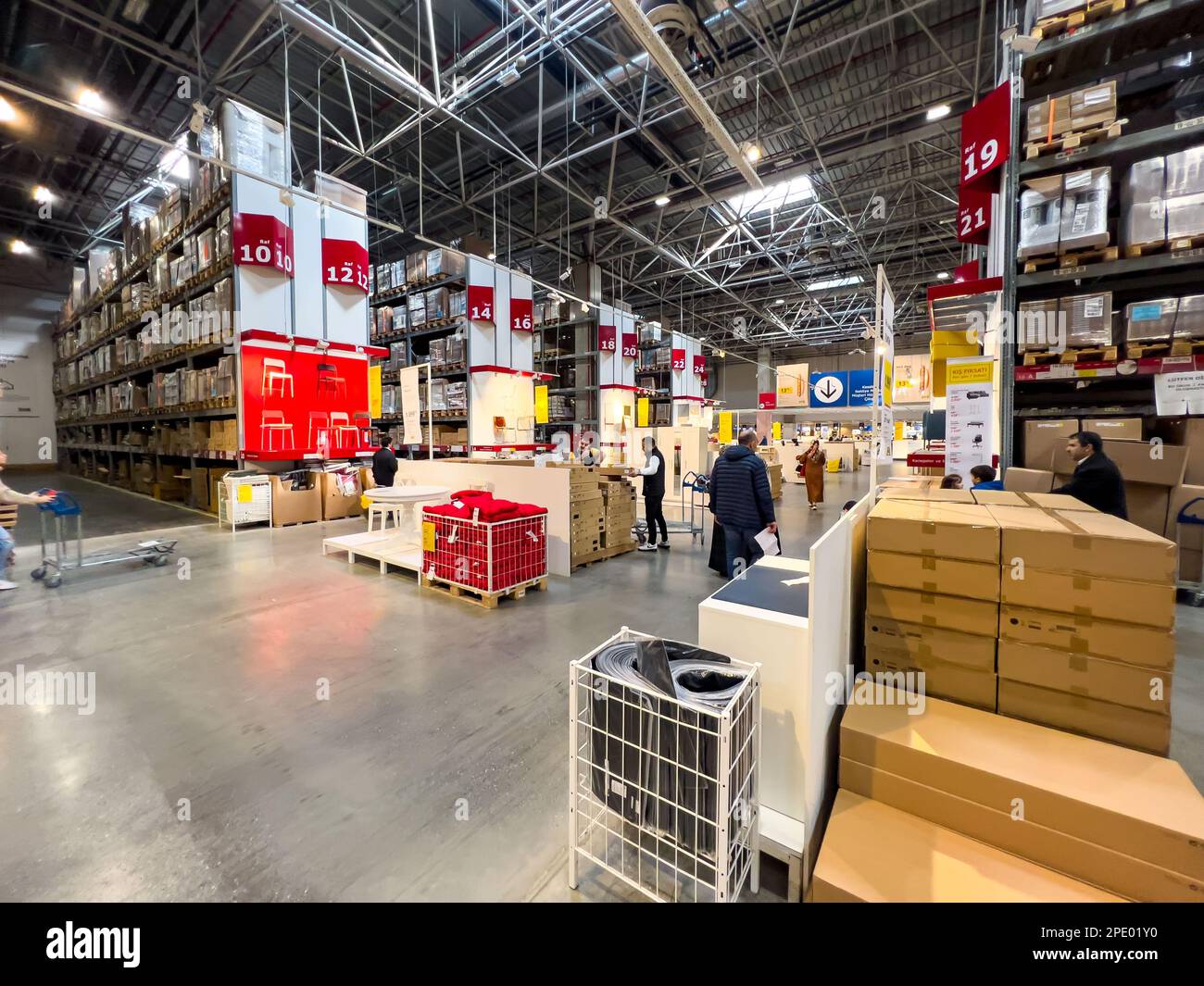 Istanbul Turkey - 01.18.2023; Indoors, pallet racks in an aisle of Ikea warehouse. In high shelves long lines of products are stored to be shipped. Stock Photo
