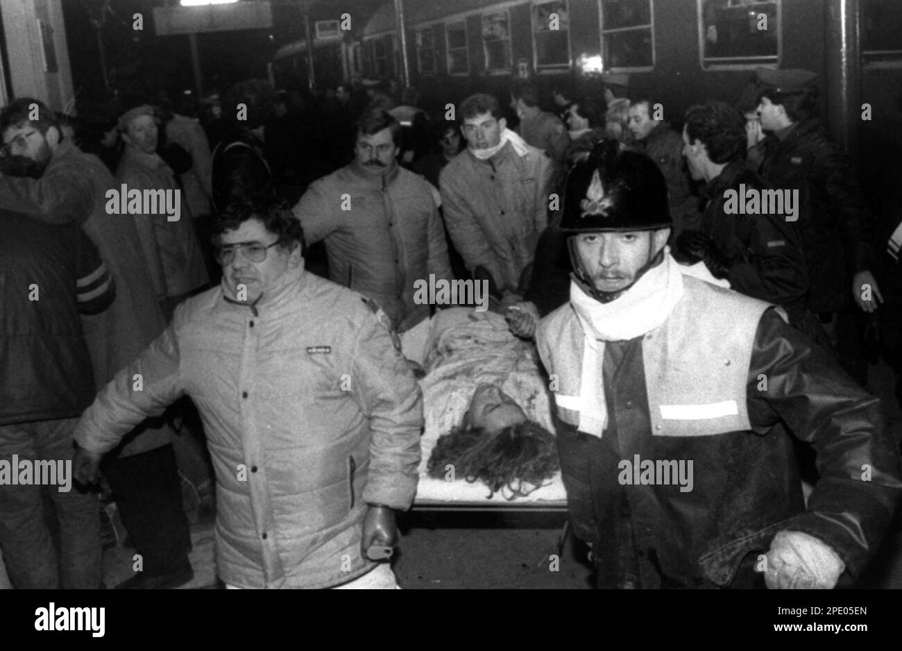 ** FILE **An injured woman receives assistance following the Bologna