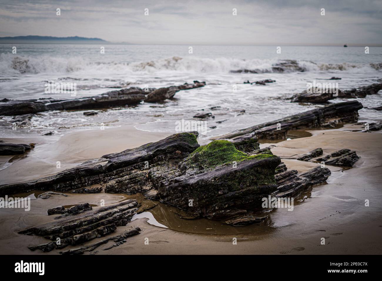 A landscape of a rocky shore of the sea on a gloomy rainy day Stock ...