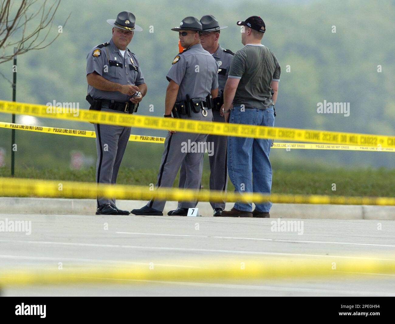 Kentucky State Police investigate the scene of a shooting after a