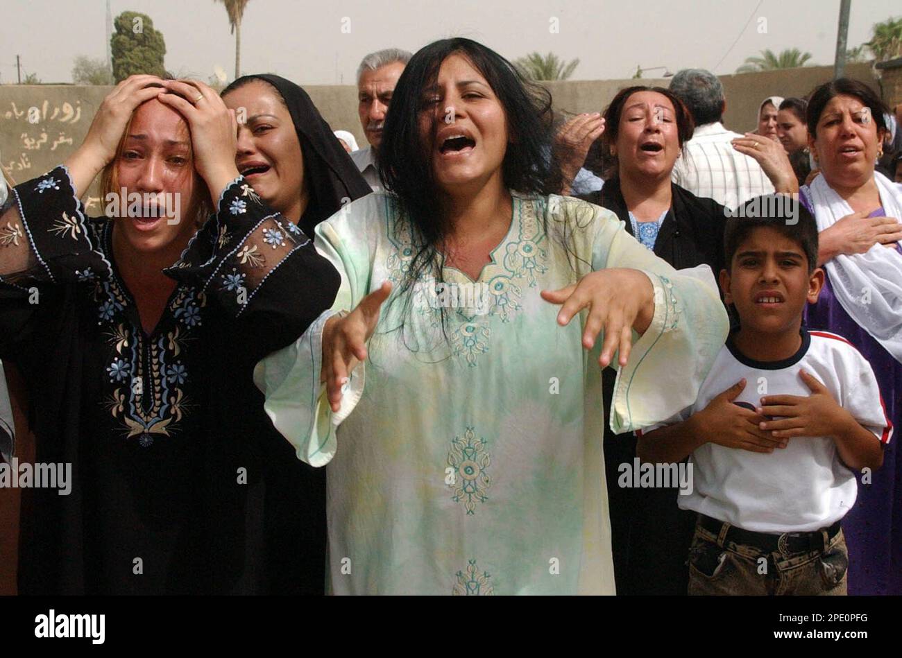Family and friends grieve as the coffin of Iraqi police officer Lt. Col ...