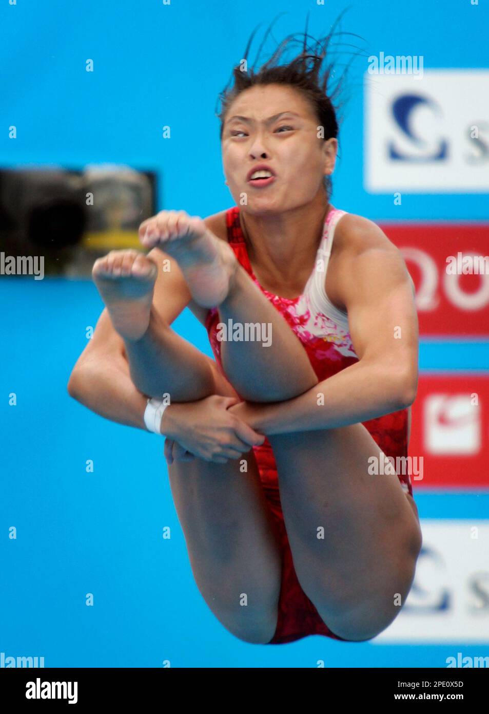 China's Wu Min Xia performs a dive in the preliminary round of the ...