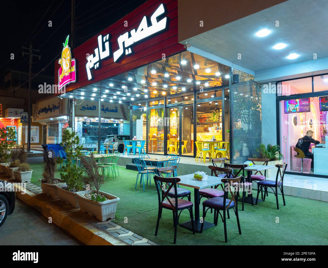 Falluja, Iraq - Feb 27, 2027: Landscape Night View of Aseer Time Cafeteria, It is a Kuwaiti Brand Having Franchises and over 325 Worldwide. Stock Photo