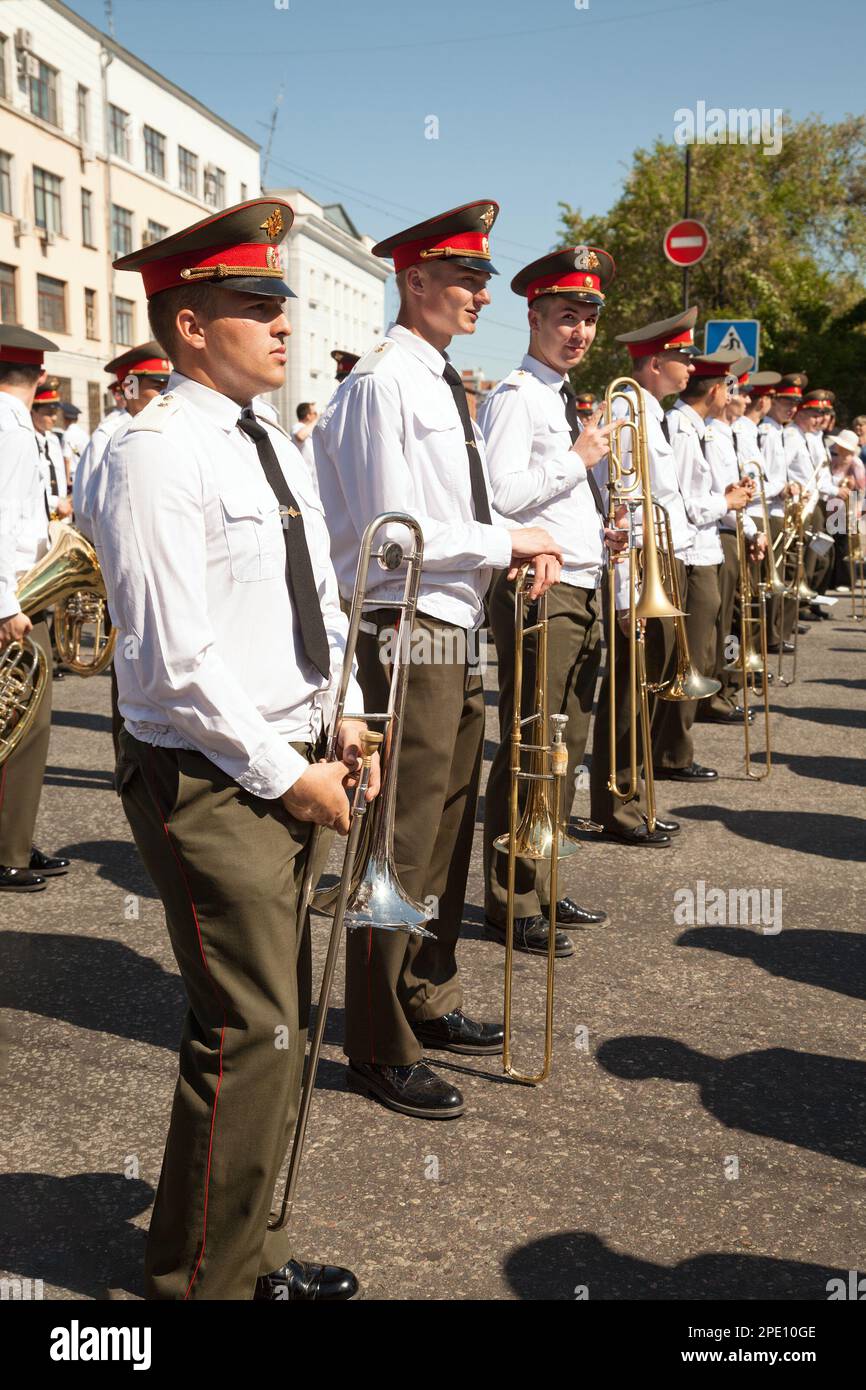Khabarovsk, Russia - May 28, 2017: Brass band street performance. Russian musicians in uniform standing in a row are about to play wind instruments on Stock Photo