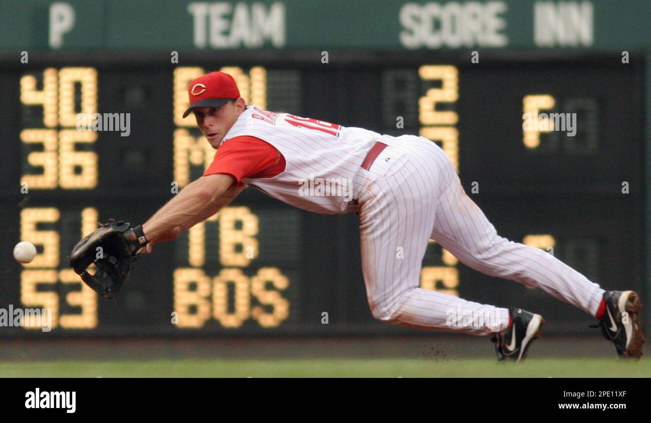 Houston Astros' Willy Taveras, bottom, slides safely into third for a  triple past Cincinnati Reds third baseman Joe Randa during the sixth inning  Friday, April 15, 2005, in Cincinnati. (AP Photo/David Kohl