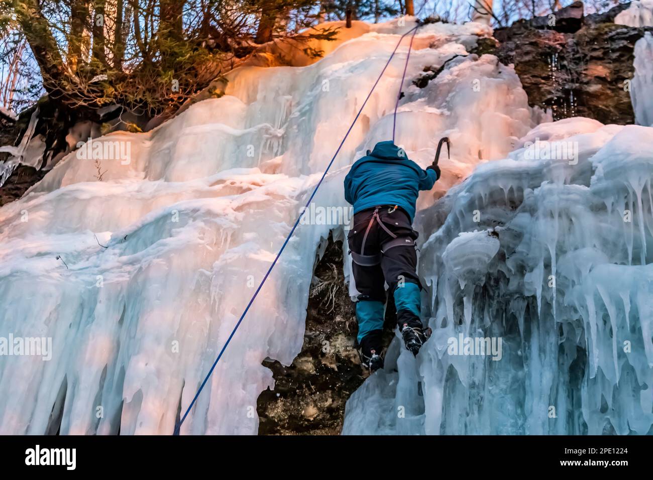 Ice climbing on Curtains, a frozen seep formation in Pictured Rocks National Lakeshore, Upper