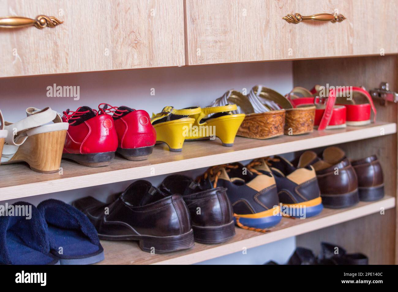 Women's and men's shoes in the closet Stock Photo - Alamy