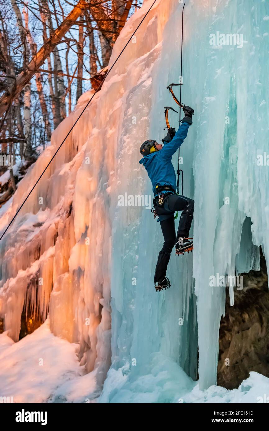 Ice climbing on Curtains, a frozen seep formation in Pictured Rocks National Lakeshore, Upper