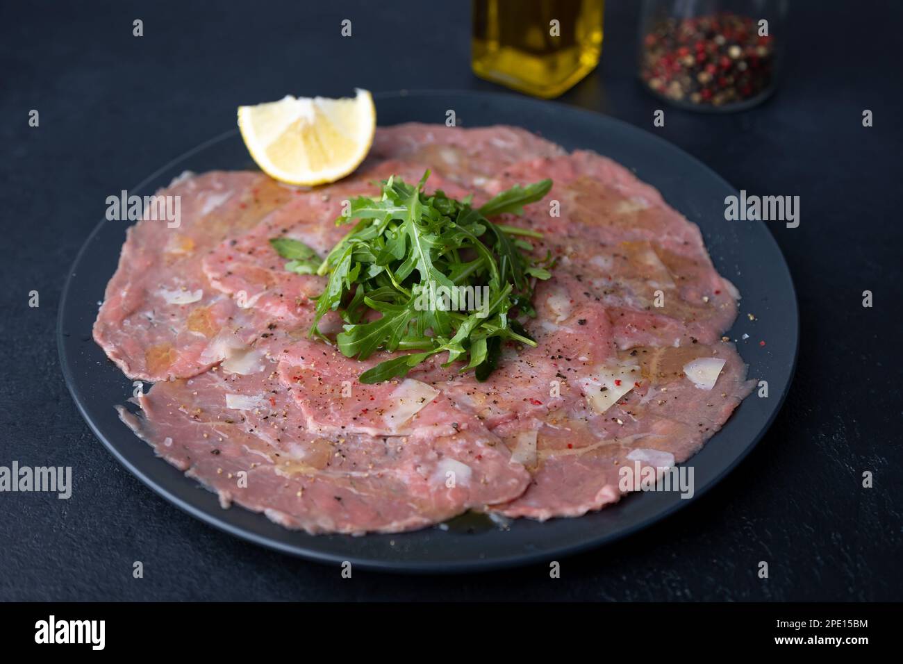 Marbled beef carpaccio with arugula, parmesan cheese, olive oil and