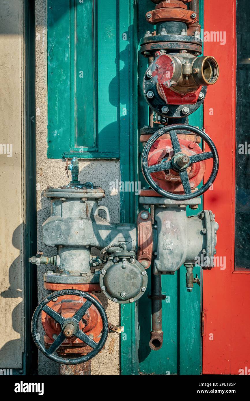 Colorful steampunk indusrial pipes and wheels in Gaslamp disctrict, San Diego, California Stock Photo