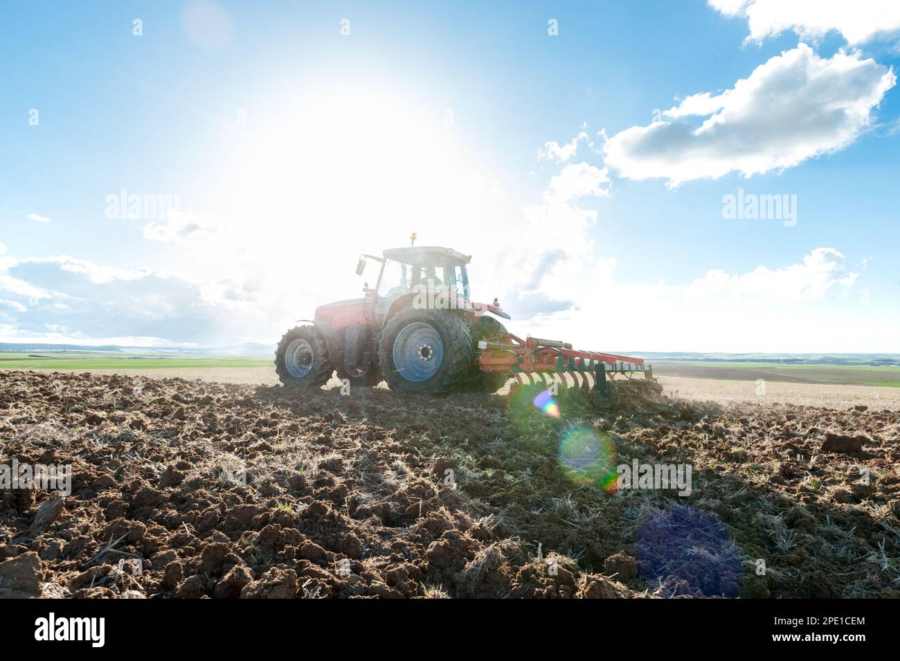 agricultural machinery working the land in the field Stock Photo