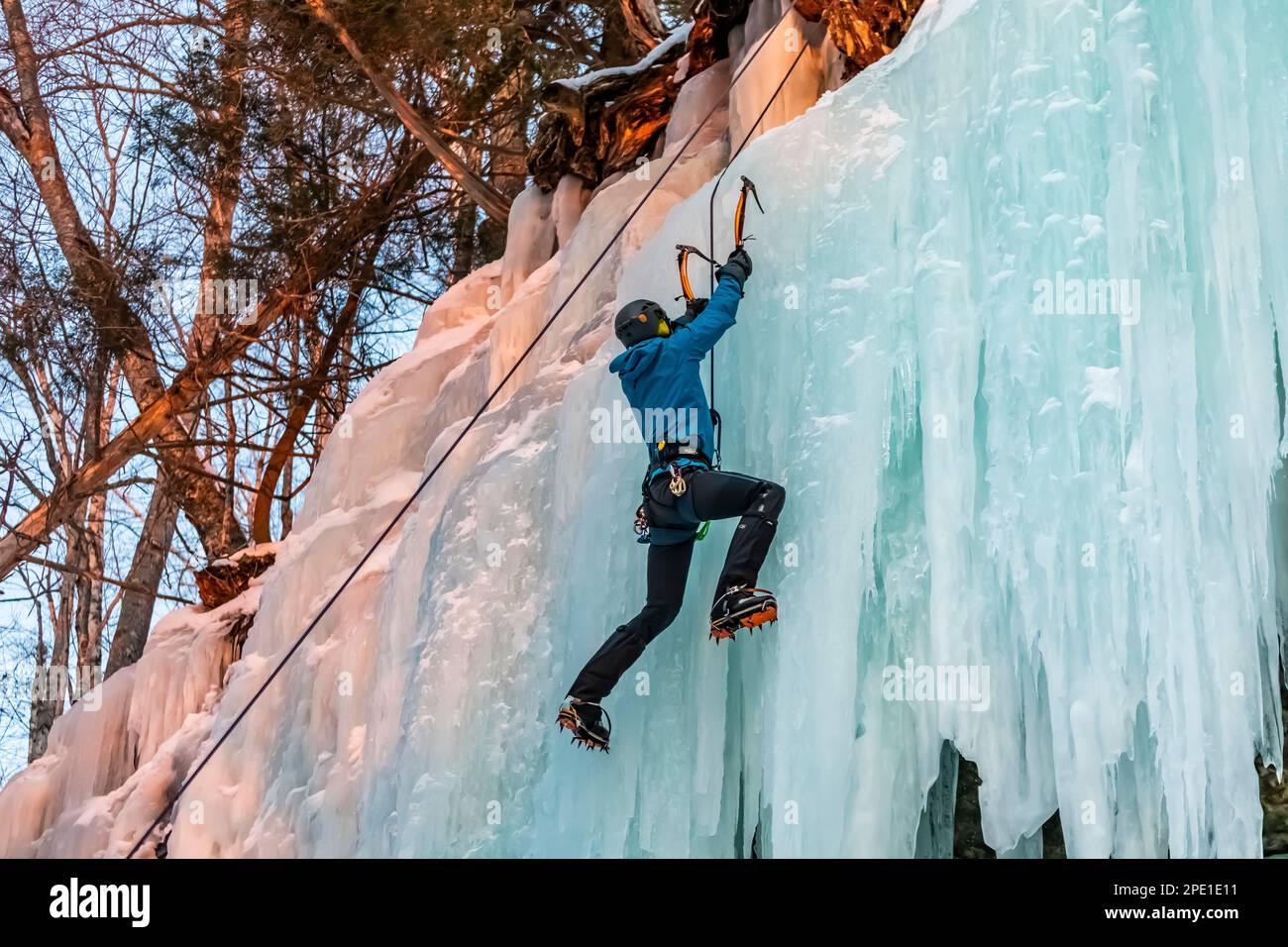 Ice climbing on Curtains, a frozen seep formation in Pictured Rocks