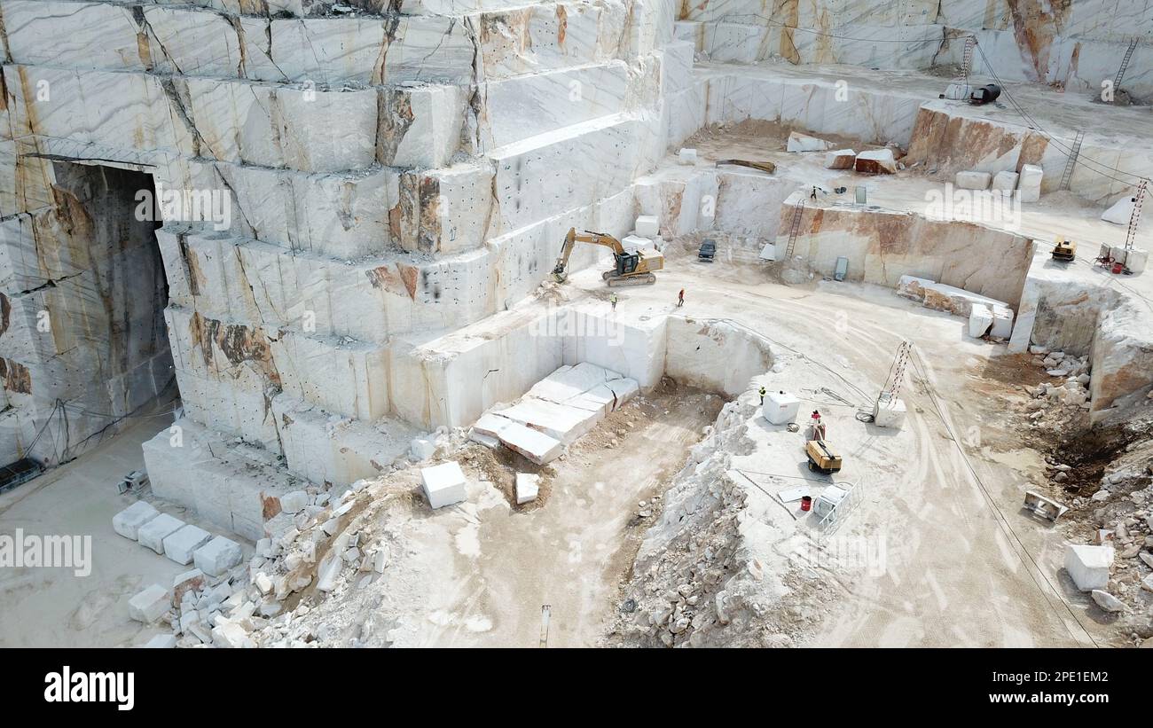Heavy machines working at a huge marble quarry in Europe. Transporting