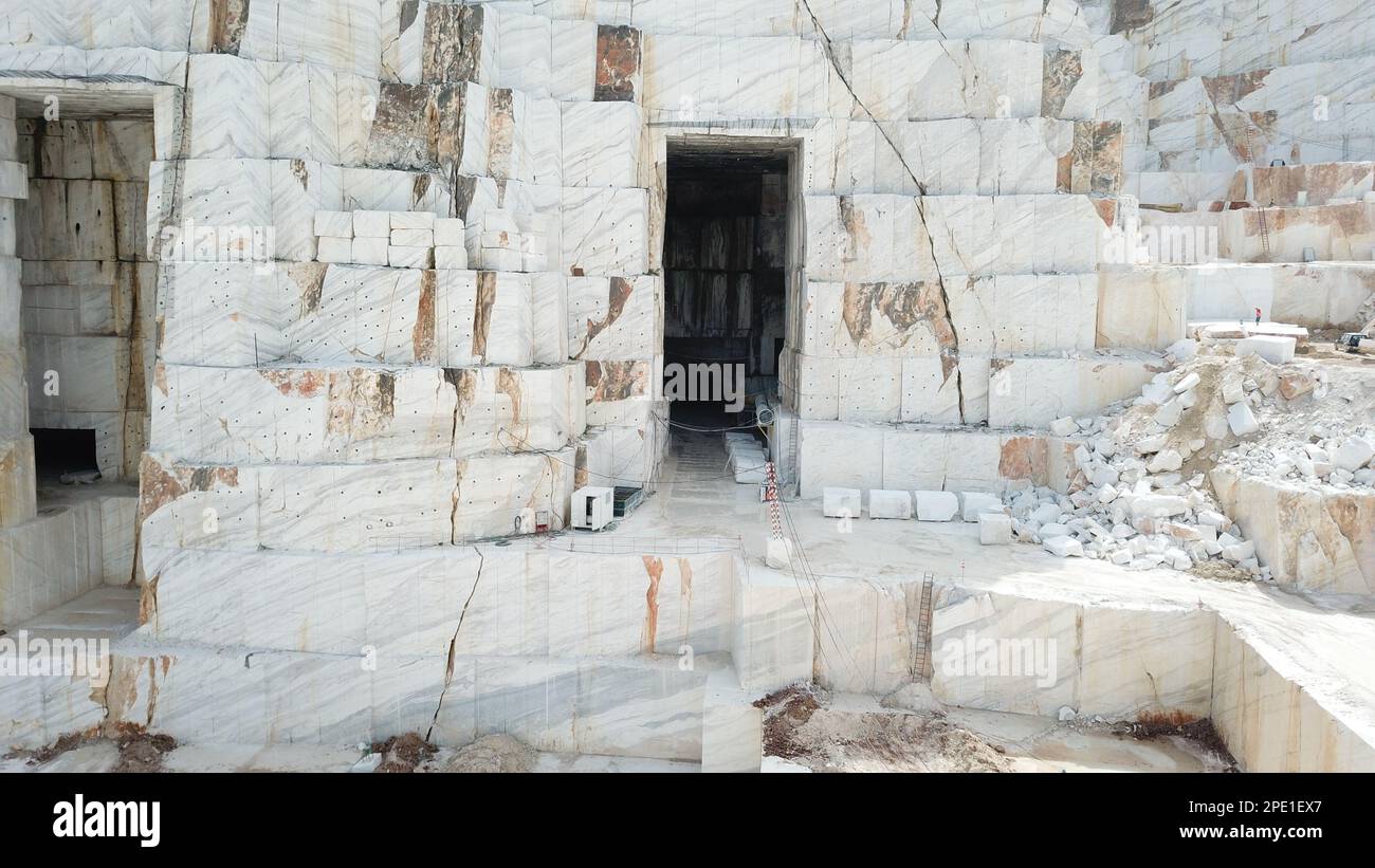 Heavy machines working at a huge marble quarry in Europe. Transporting