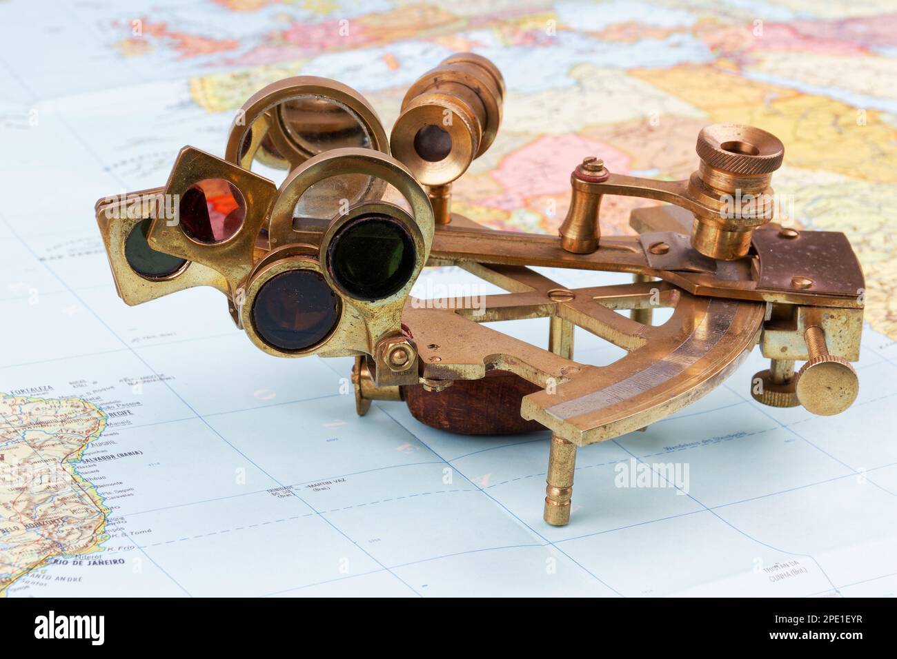 nautical sextant with optics lying on paper world map Stock Photo - Alamy