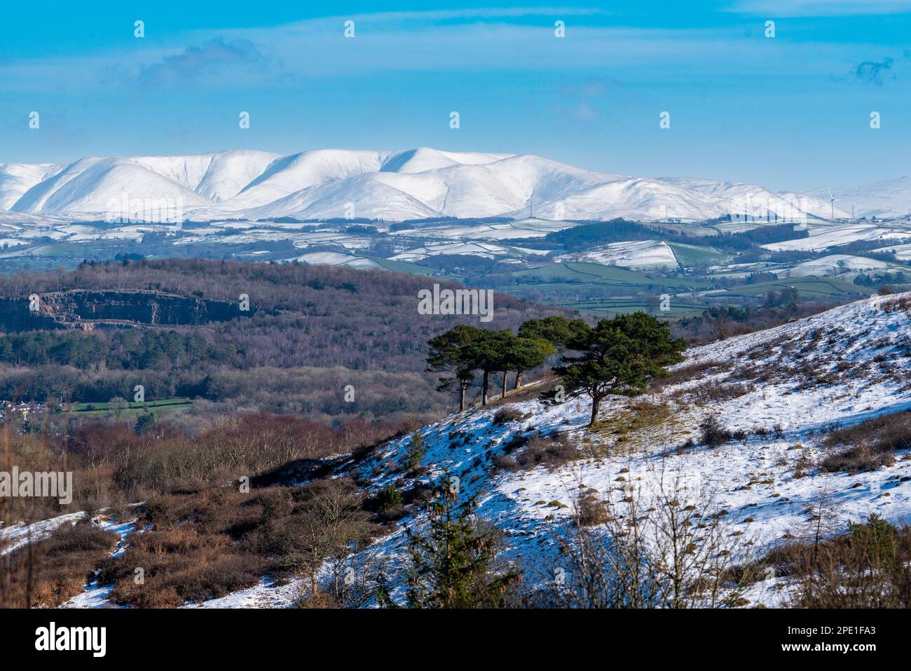 A view of snow on the Yorkshire Dales fells from Arnside Knott,  Arnside, Milnthorpe, Cumbria, UK Stock Photo