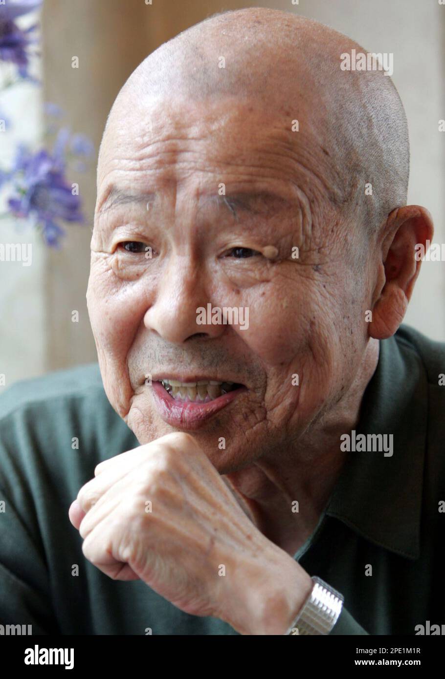 Former Kamikaze pilot Toshio Yoshitake , 82, speaks during an interview with The Associated Press in Funabashi, east of Tokyo, June 16, 2005. Yoshitake, who lost all other17 pilots and flight instructors in the "Special Assault Corps" unit who took off with him from the Imperial Army airstrip just east of Tokyo in November, 1944, shrugs off Yasukuni Shrine's political baggage."We have a right to pay our respects," he said. (AP Photo/Katsumi Kasahara) Stock Photo