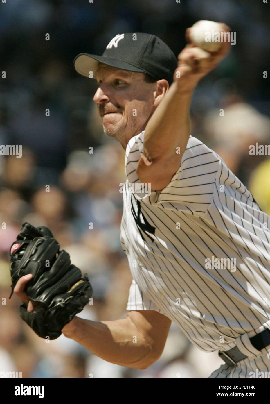 New York Yankees pitcher Randy Johnson delivers a pitch in the sixth  innning of the Yankees 9-4 victory over the Cleveland Indians, Sunday, July  10, 2005, at Yankee Stadium in New York.