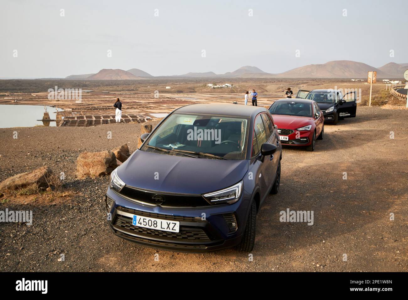 tourist hire cars parked at lay by near viewpoint overlooking salinas