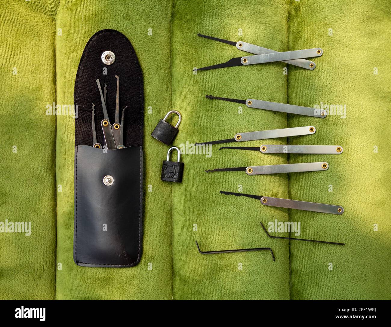 Many lock picking tools in a case, tension wrenches and 2 little