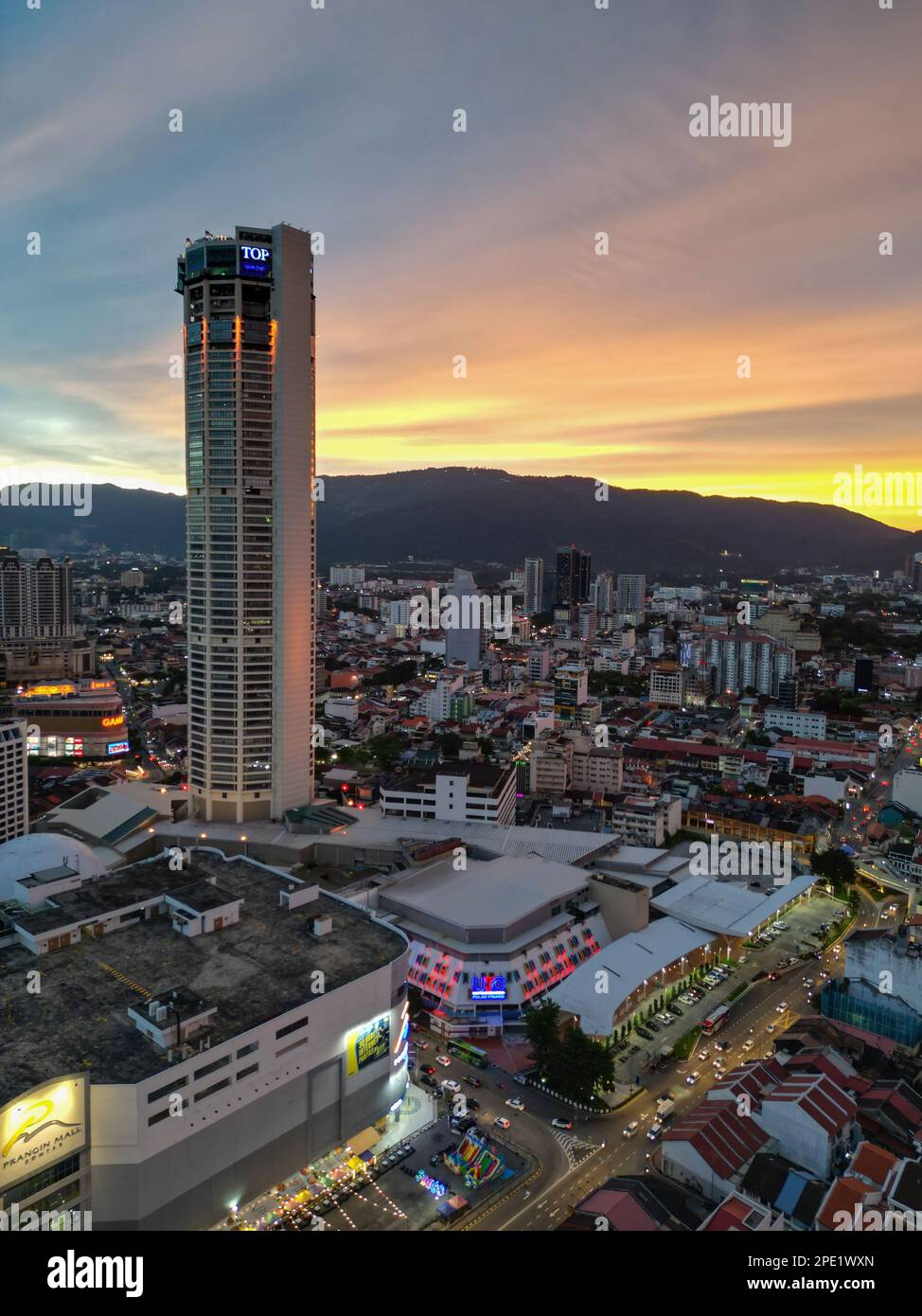 George Town, Penang, Malaysia - Sep 26 2022: Vertical view of Komtar building and Prangin Mall in dramatic sunset hour Stock Photo