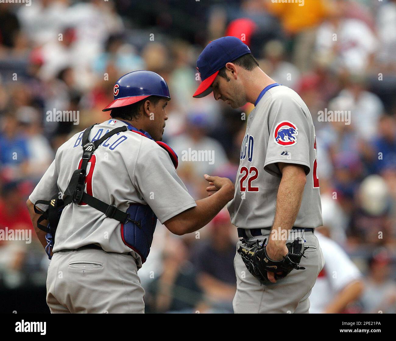 Chicago Cubs catcher Henry Blanco and homeplate umpire Jerry Crawford watch  as St. Louis Cardinals Jim Edmonds hits a solo homerun in the first inning  at Busch Stadium in St. Louis on