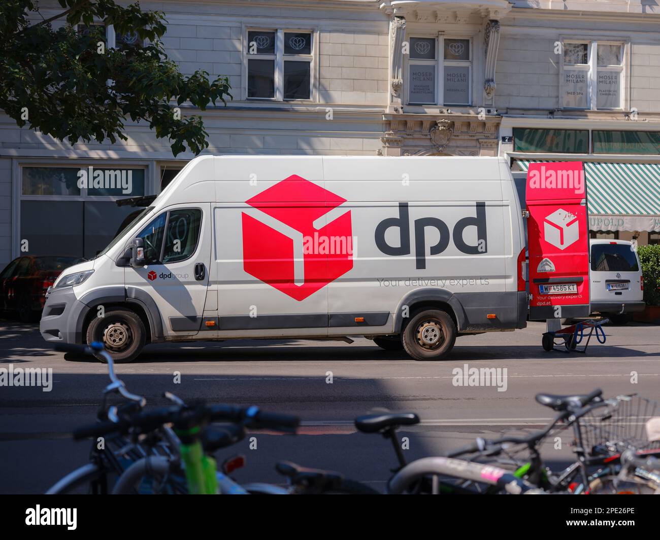 Vienna, Austria - August 11, 2022: Parked DPD Courier Delivery Van over downtown. DPDgroup is an international parcel delivery service with an extensive network Stock Photo