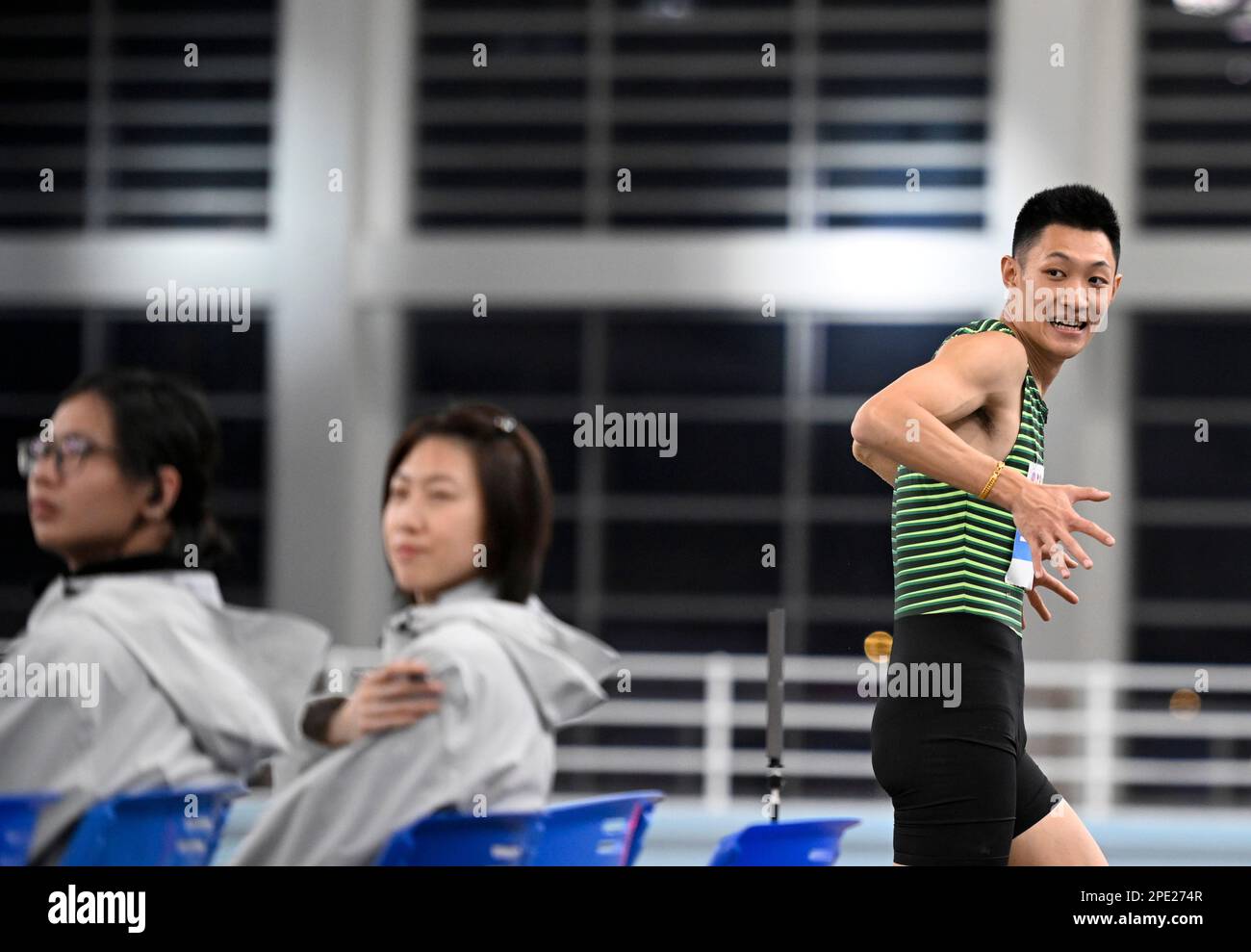 Tianjin. 15th Mar, 2023. Wang Jianan reacts during the men's long jump