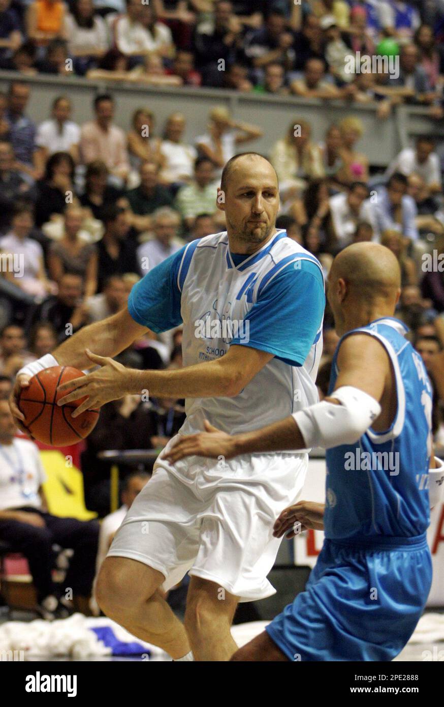 Dino Radja left challenges for the ball with Aleksandar