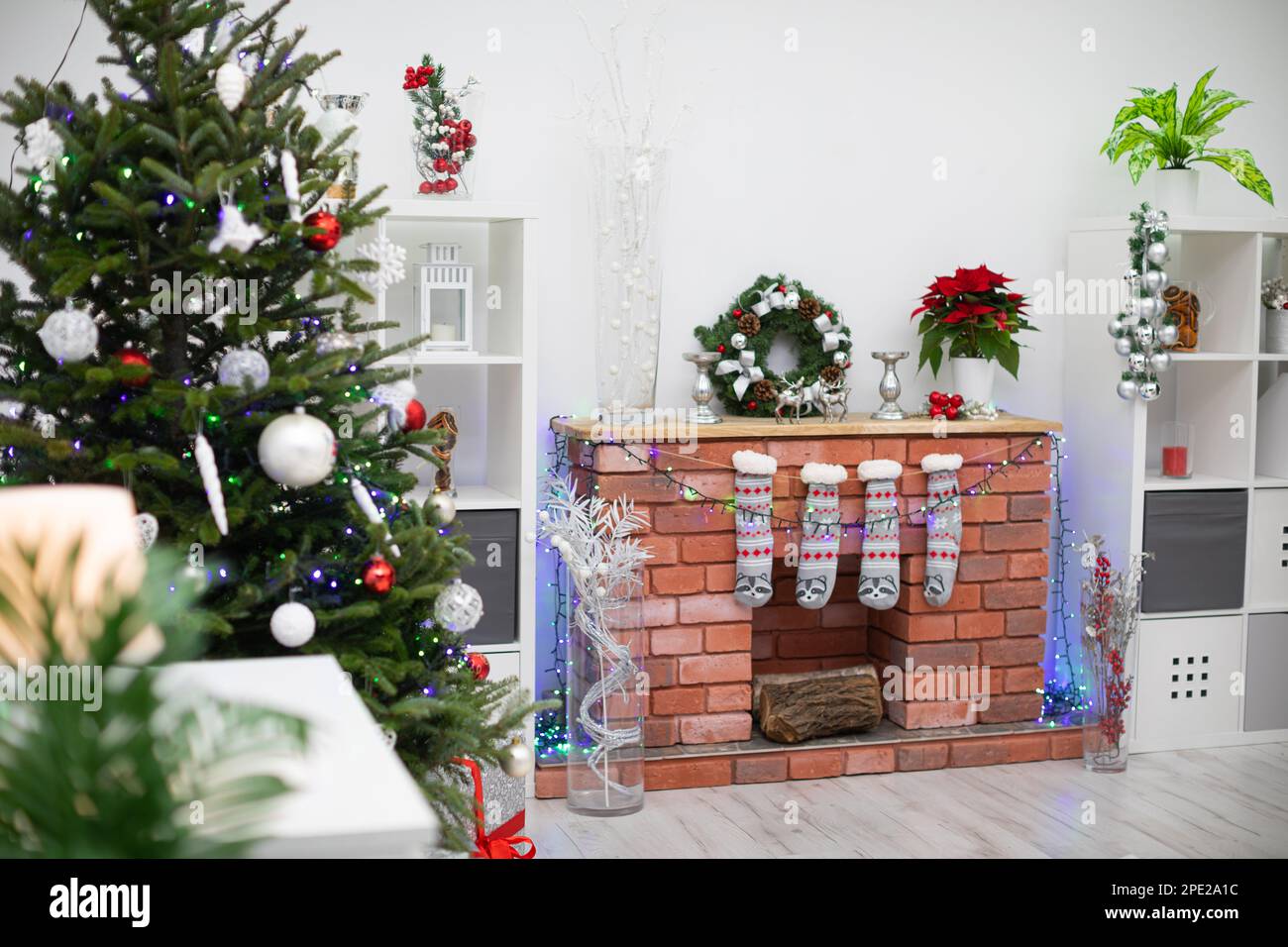Christmas living room with fireplace and decorations Stock Photo - Alamy