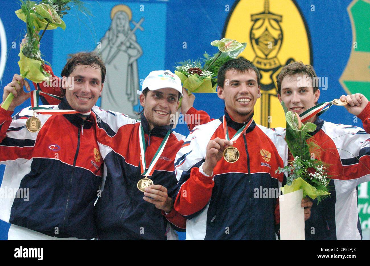 Members of Russia's men fencing team (left to right) Stanislav Pozdniakov,  Alexei Diatchenko, Dmitri Aibouchev and Alexey Yakimenko show their gold  medals after winning the team sabre final at the 30th Fencing