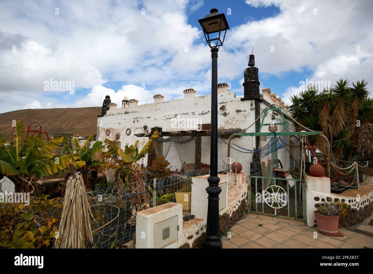 one of the more unusual casitas de femes little houses decorated in a beachcomber style with oddities and ornaments near femes Lanzarote, Canary Islan Stock Photo
