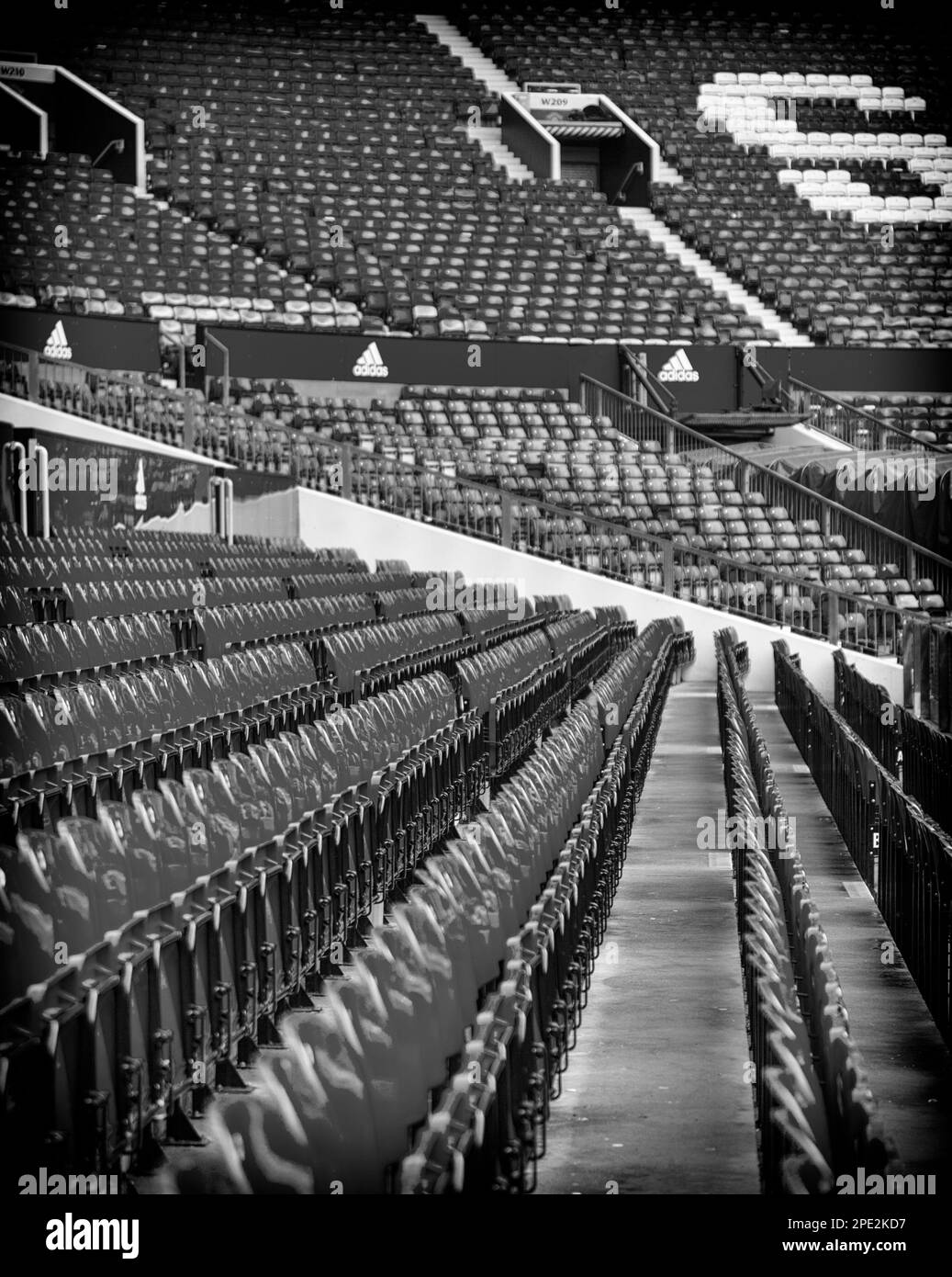 Black and White Image of Row upon Row of Empty Seats at Old Trafford, Home of Manchester United Stock Photo