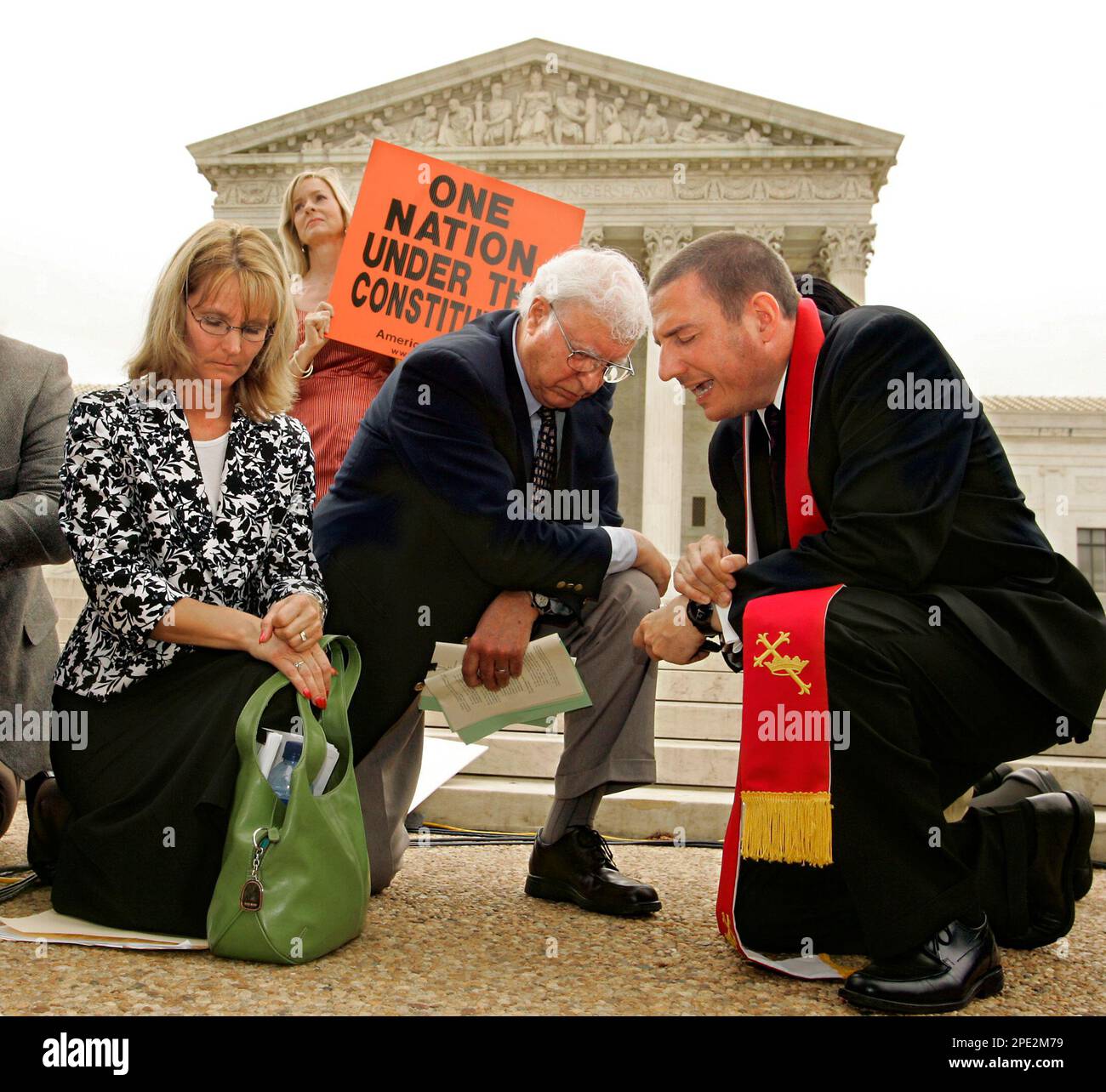 Rev. Rob Schenck, president of Faith and Action, right, leads