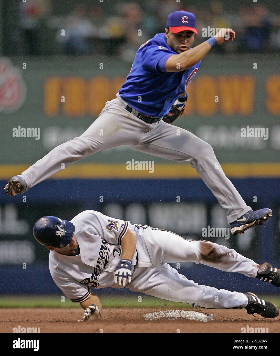 Milwaukee Brewers' Brady Clark is hit by a pitch from Minnesota