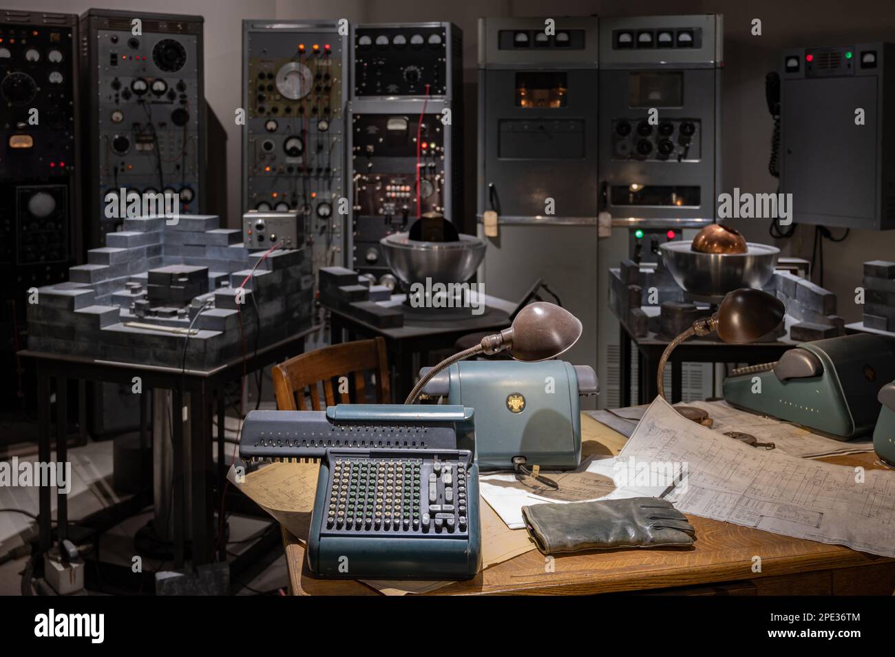 A Vintage military radio room int with electronic equipment, wall of