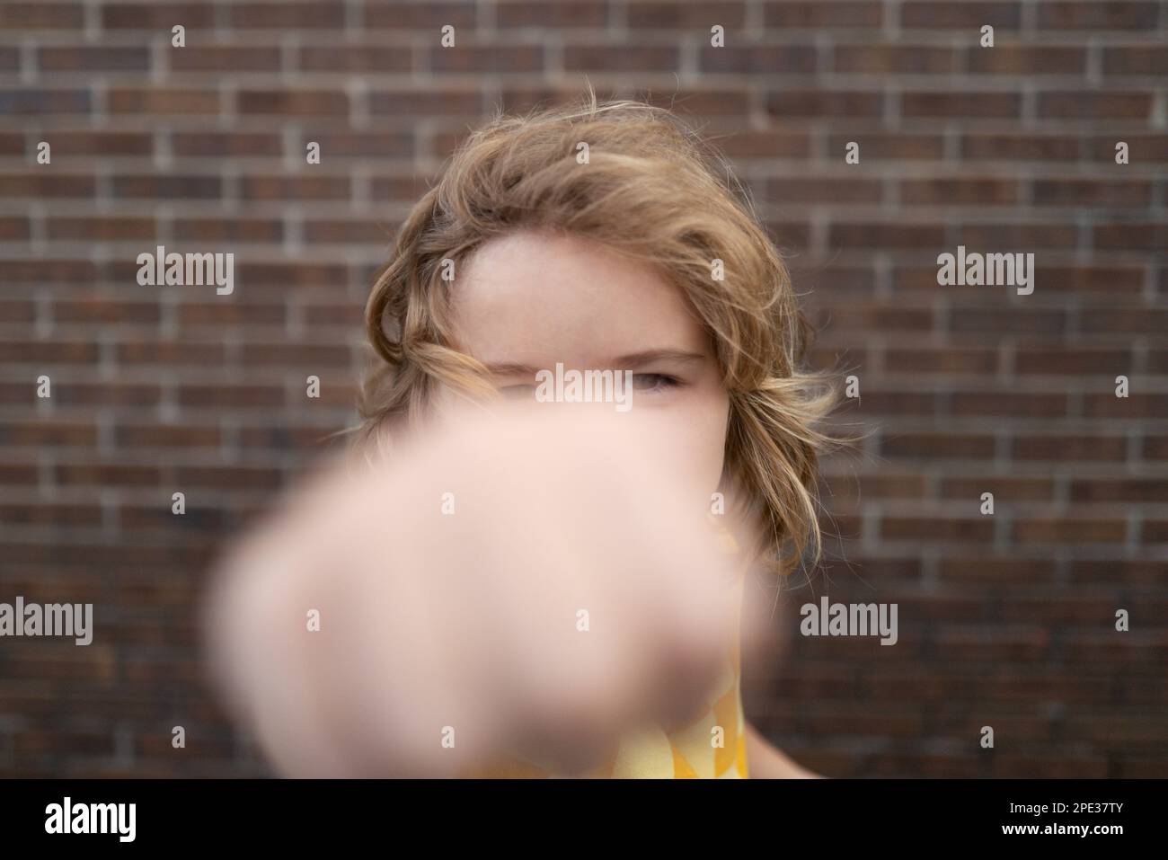 Child temper with angry expression. Angry hateful little anger boy, child furious. Angry rage kids face close up. Anger hateful child with furious Stock Photo