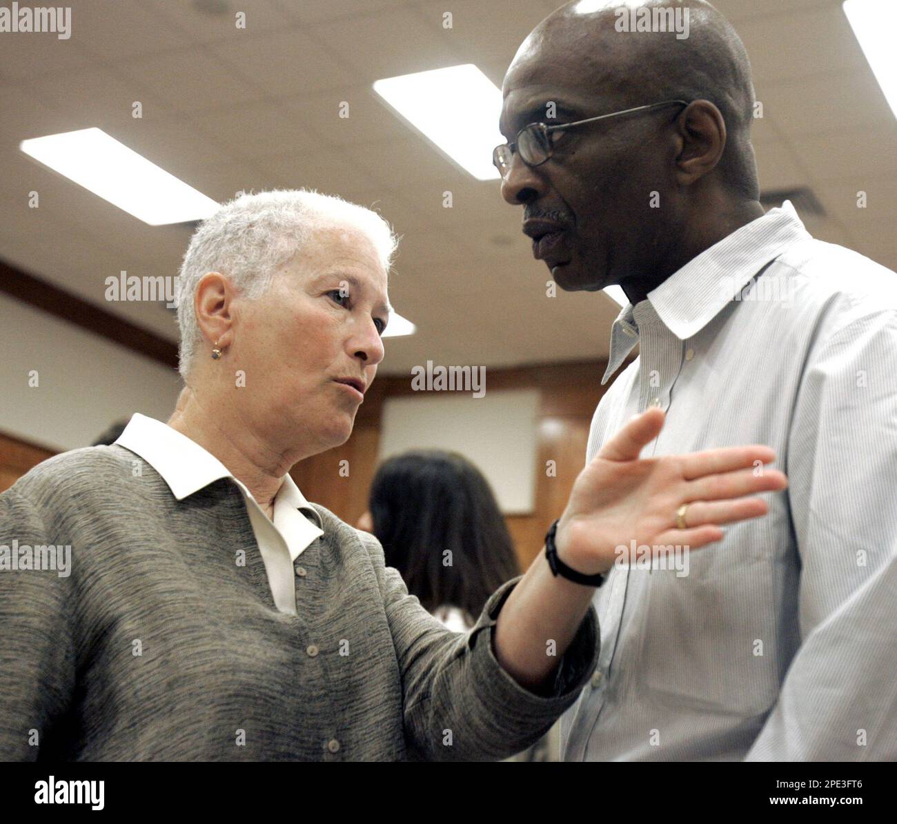 Rita Schwerner Bender, left, widow of Michael Schwerner and Ben Chaney,  brother of James Chaney, confer Thursday, June 16, 2005, during a recess in  the trial of Edgar Ray Killen, who is