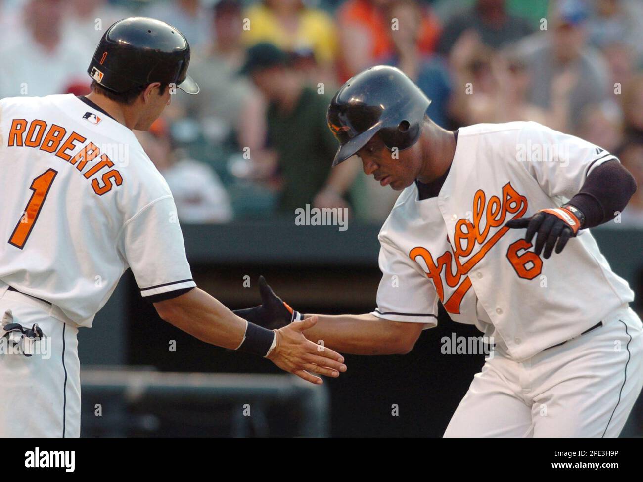 Baltimore Orioles' Brian Roberts congratulates Melvin Mora after Mora hit a  two-run homer, scoring Roberts, off Houston Astros pitcher Wandy Rodriguez  in the first inning Wednesday, June 15, 2005, in Baltimore.(AP Photo/Gail