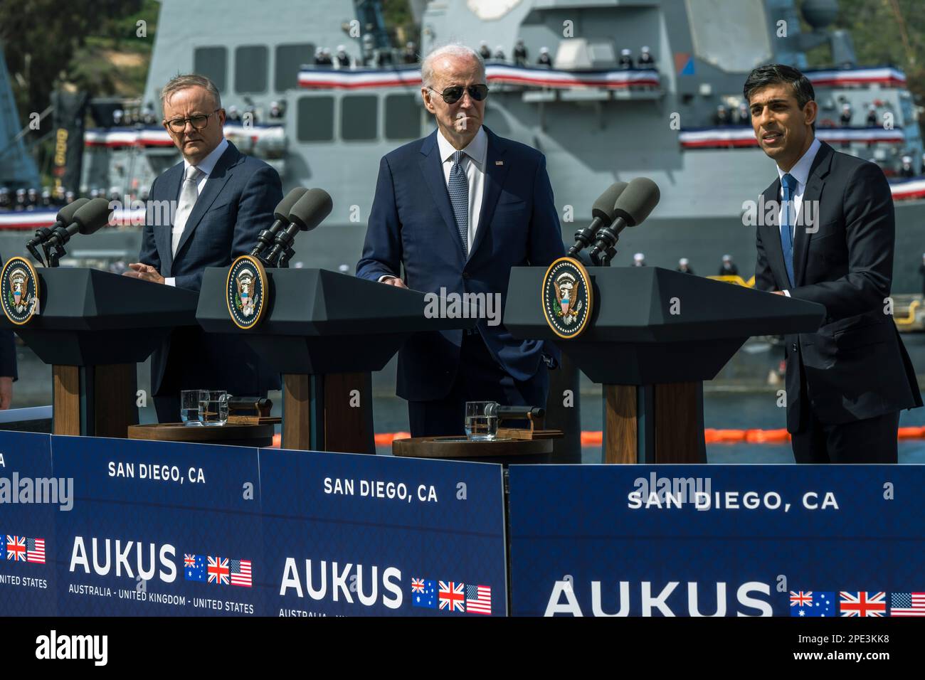 San Diego, United States of America. 13 March, 2023. British Prime Minister Rishi Sunak, right, responds to a question as U.S President Joe Biden, center,  and Australian Prime Minister Anthony Albanese, left, look on during a press conference following their trilateral meeting at Point Loma naval base, March 13, 2023 in San Diego, California.  Credit: Chad McNeeley/DoD Photo/Alamy Live News Stock Photo