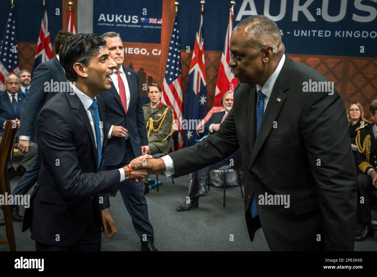 San Diego, United States of America. 13 March, 2023. U.S Secretary of Defense Lloyd Austin, right, greets British Prime Minister Rishi Sunak, left, during a trilateral meeting with at Point Loma naval base March 13, 2023 in San Diego, California. The three leaders of the AUKUS security pact agreed on expanding their nuclear-powered submarine fleet.  Credit: Chad McNeeley/DoD Photo/Alamy Live News Stock Photo