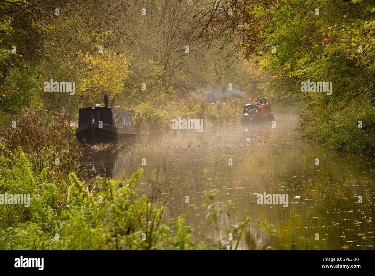 Narrowboats on the Kennet and Avon Canal surrounded by autumn colour, Bradford-on-Avon, Wiltshire, England. Stock Photo